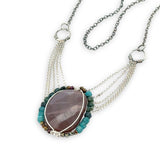 Mauve moonstone nugget pendant surrounded by pyrite and chrysocolla cube gemstones with multi layered chain webbing necklace