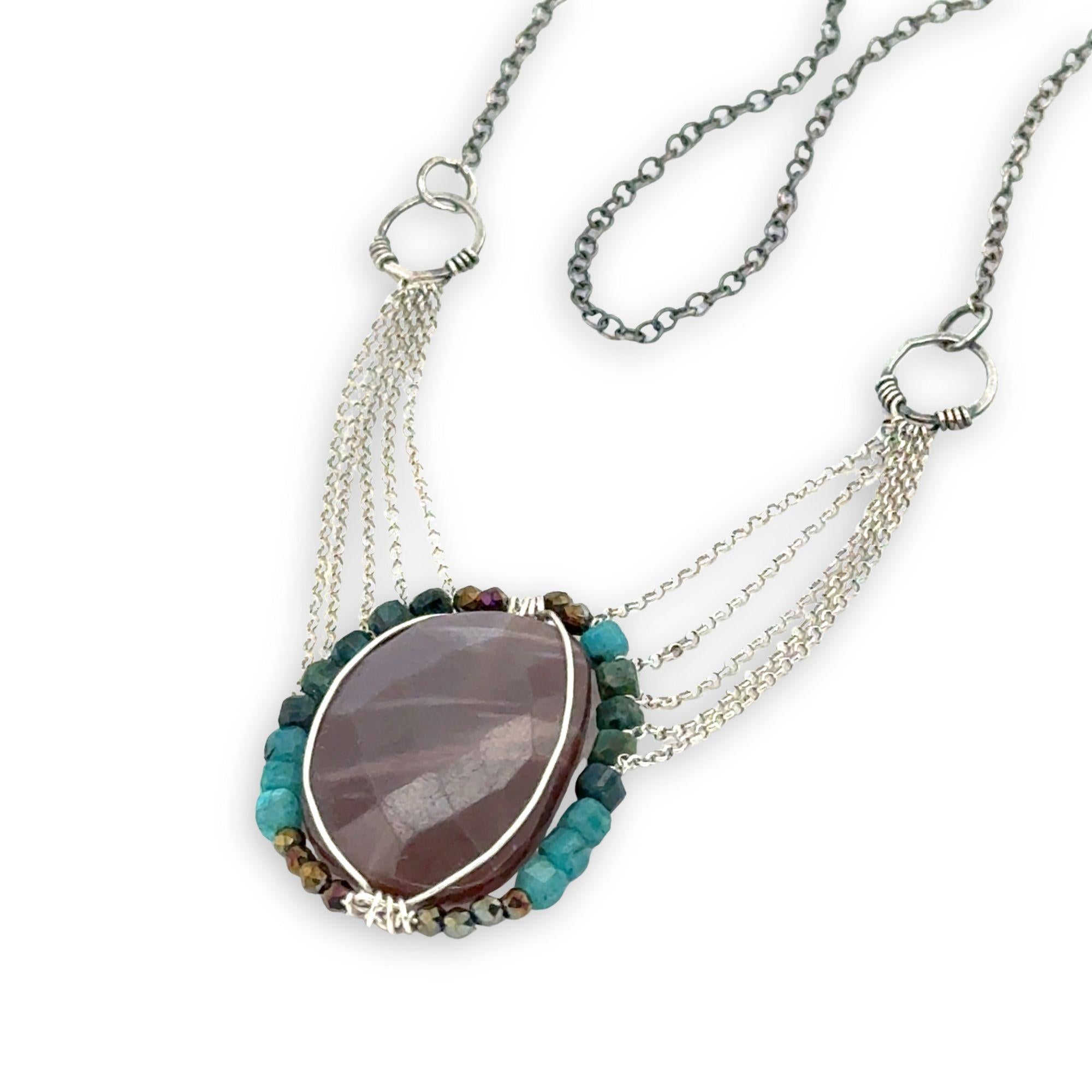 Mauve moonstone nugget pendant surrounded by pyrite and chrysocolla cube gemstones with multi layered chain webbing necklace