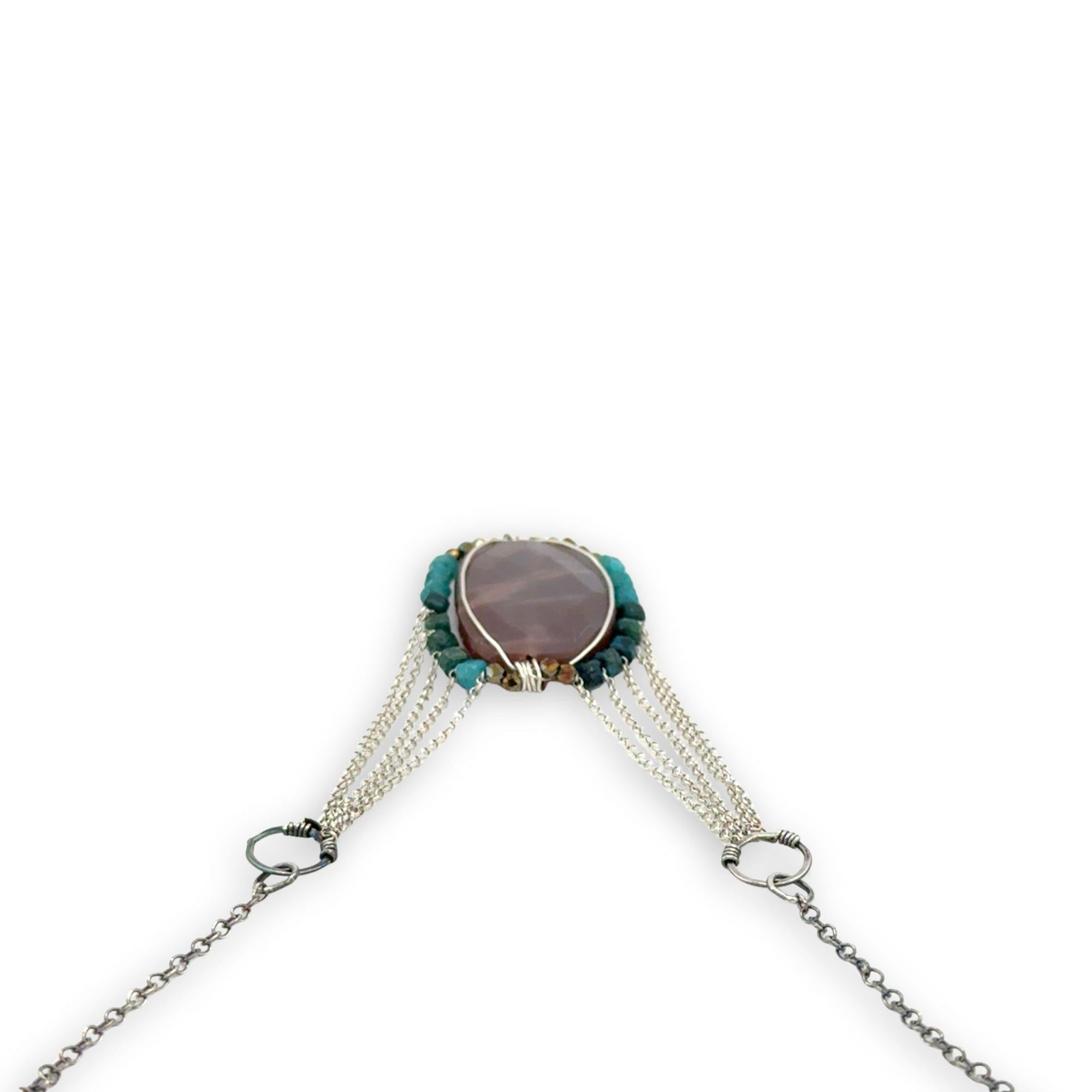 Mauve moonstone nugget pendant surrounded by pyrite and chrysocolla cube gemstones with multi layered chain webbing necklace