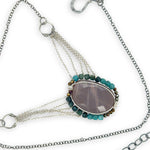 Mauve moonstone nugget pendant surrounded by pyrite and chrysocolla cube gemstones with multi layered chain webbing necklace