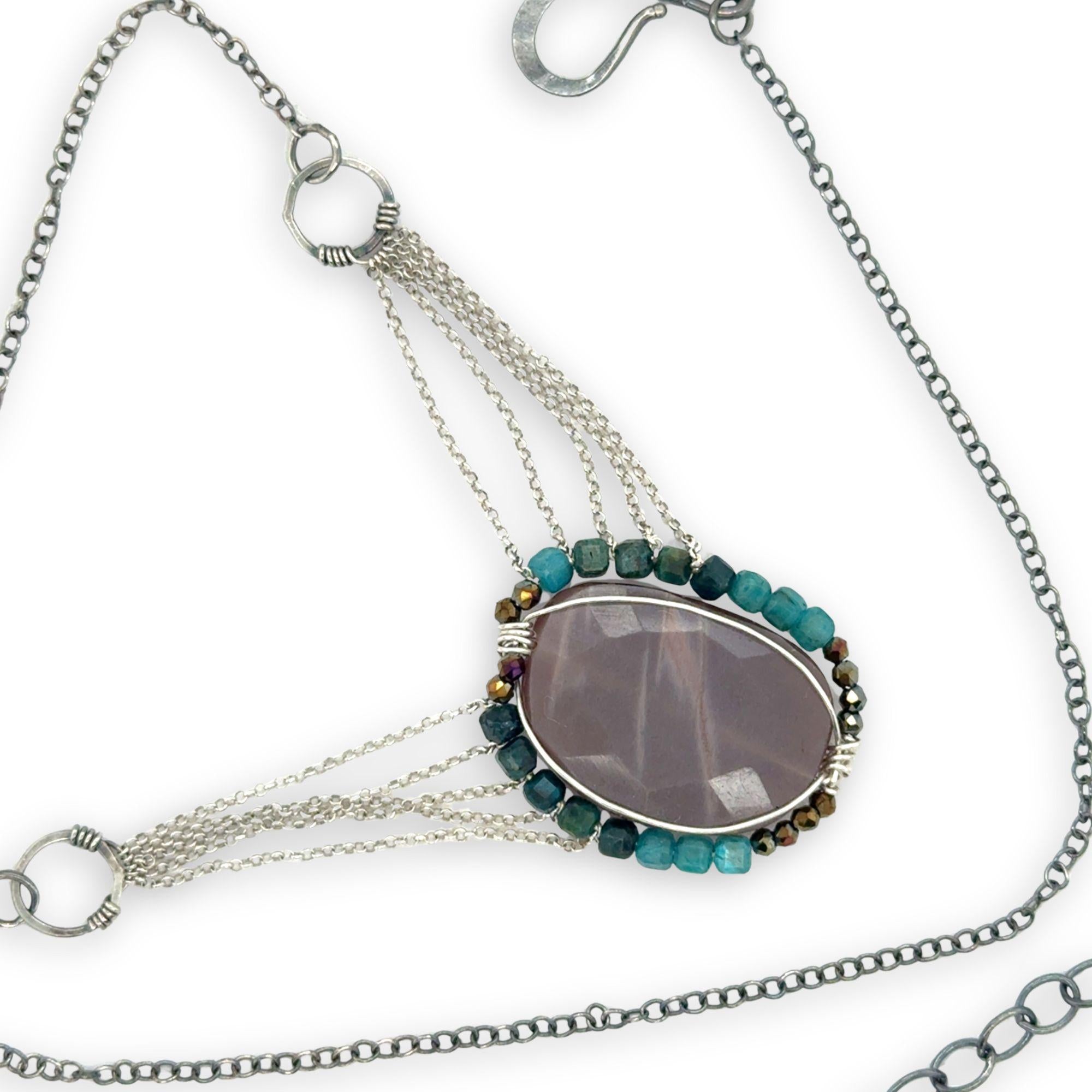 Mauve moonstone nugget pendant surrounded by pyrite and chrysocolla cube gemstones with multi layered chain webbing necklace