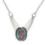 Mauve moonstone nugget pendant surrounded by pyrite and chrysocolla cube gemstones with multi layered chain webbing necklace