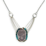 Mauve moonstone nugget pendant surrounded by pyrite and chrysocolla cube gemstones with multi layered chain webbing necklace
