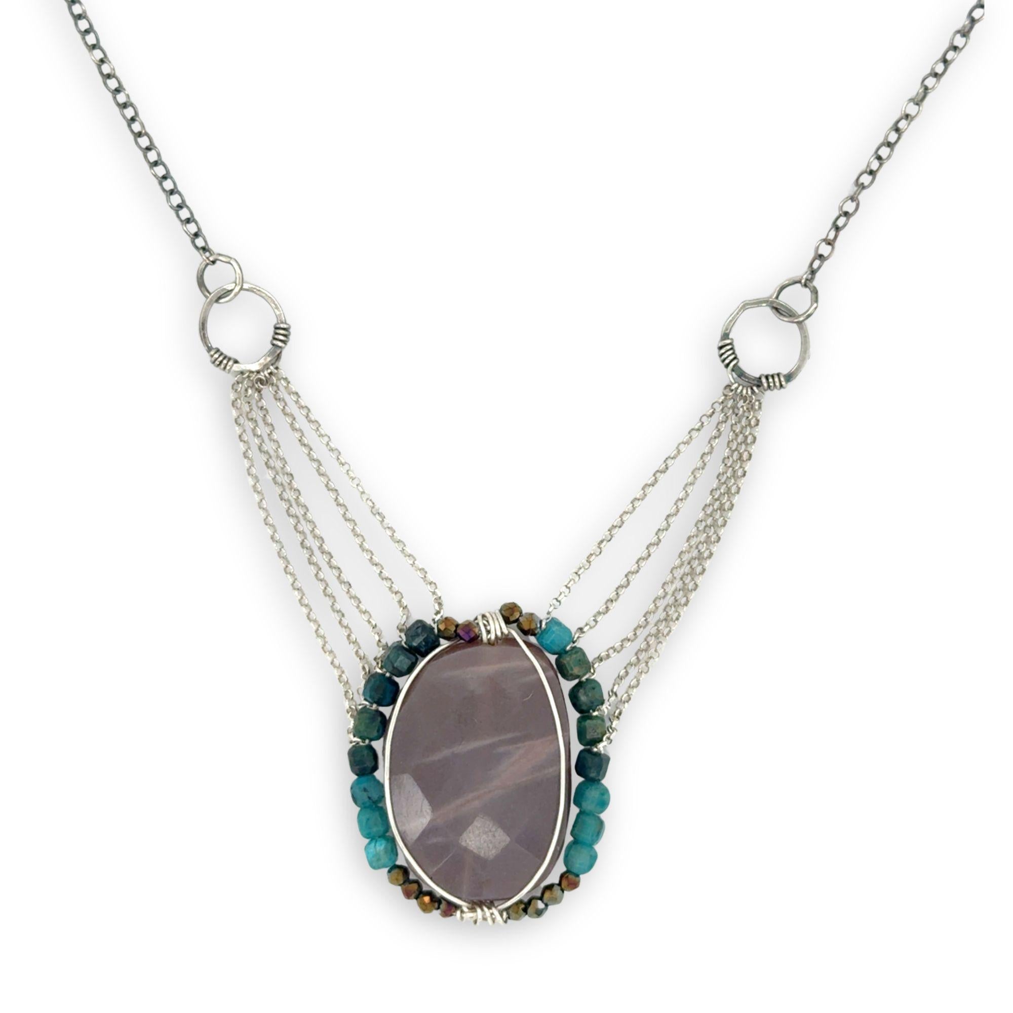 Mauve moonstone nugget pendant surrounded by pyrite and chrysocolla cube gemstones with multi layered chain webbing necklace