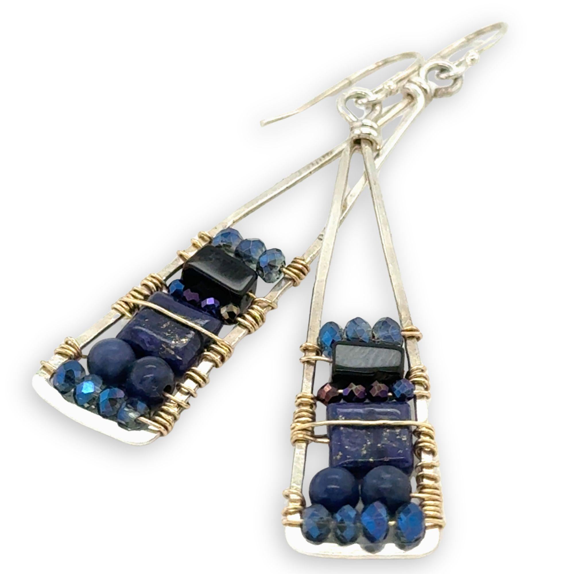 Lapis and onyx gemstones stacked with blue crystal on gold filled wire within a skinny, tall sterling silver triangle shaped earrings