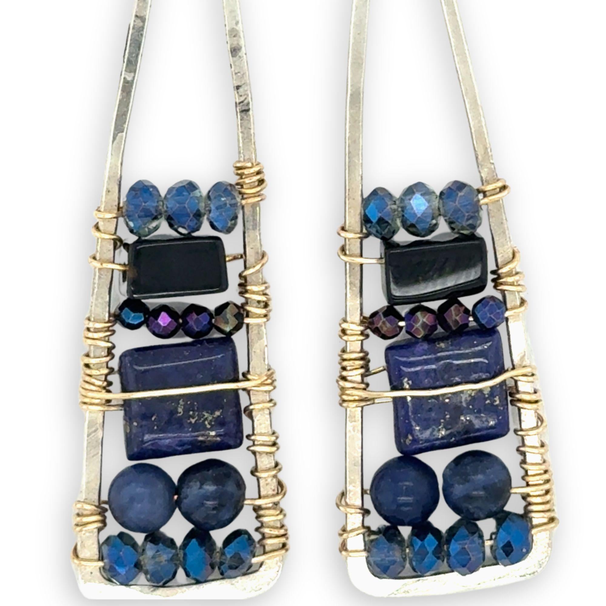 Lapis and onyx gemstones stacked with blue crystal on gold filled wire within a skinny, tall sterling silver triangle shaped earrings