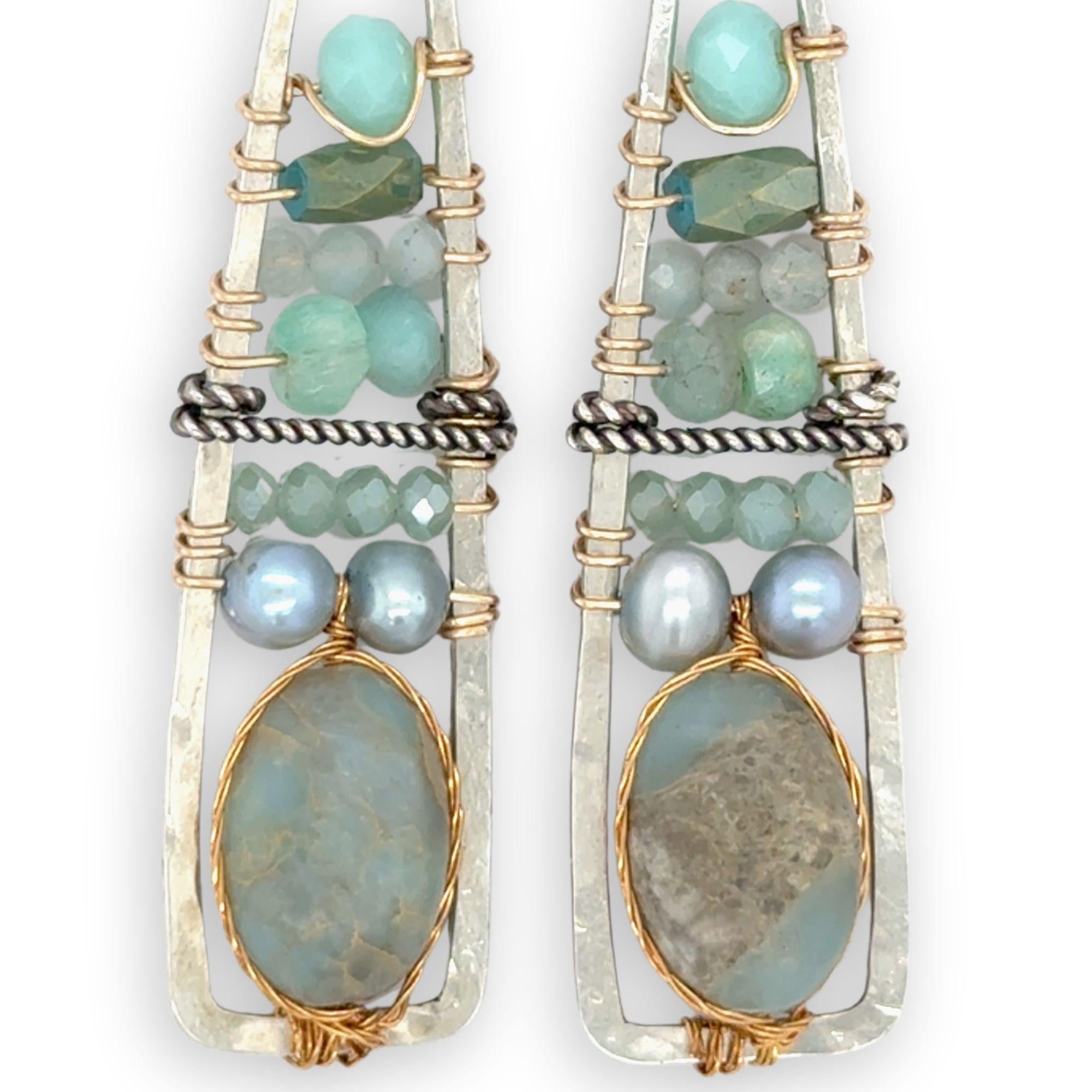 Terra verde smooth oval gemstones layered with light blue fresh water pearl, crystal, and amazonite gemstones on gold filled wire within skinny triangle shaped earrings