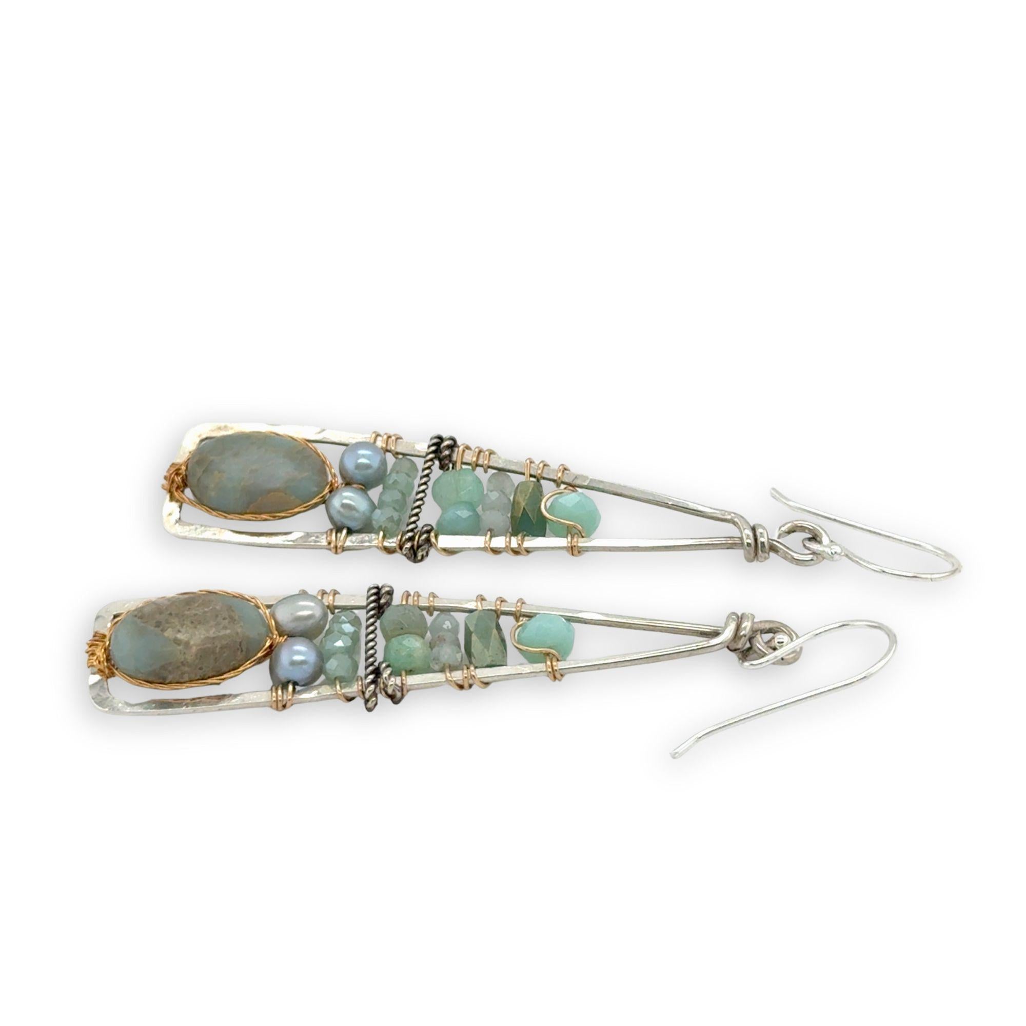 Terra verde smooth oval gemstones layered with light blue fresh water pearl, crystal, and amazonite gemstones on gold filled wire within skinny triangle shaped earrings