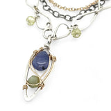 Sterling silver stamped mini drop necklace with smooth tanzanite drop and green kyanite gemstones on a triple strand gold filled. darkened sterling, and handmade sterling link chain