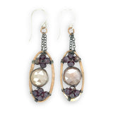 hammered bronze oval earrings with moonstone and garnet faceted gemstones in oxidized sterling silver wire hanging from oxidized sterling delicate chain