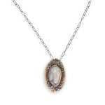 Bronze oval pendant filled with mauve moonstone, garnet, and pyrite gemstones with a darkened sterling silver oval chain necklace