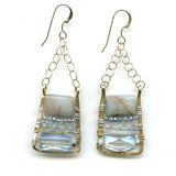 Blue crystal, apatite, and terra verde jasper gemstones are stacked on top of each other in a brass box earring hanging from gold filled textured chain