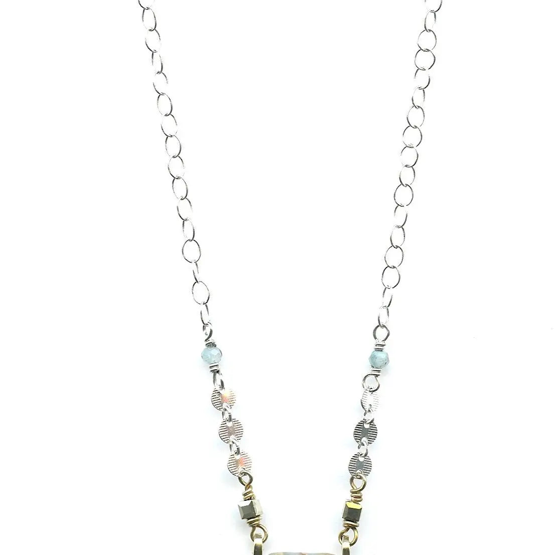 crystal, apatite, blue quartz, and terra verde jasper gemstones stacked on top of each other in a brass box mini pendant necklace on sterling silver delicate chain