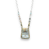 crystal, apatite, blue quartz, and terra verde jasper gemstones stacked on top of each other in a brass box mini pendant necklace on sterling silver delicate chain