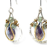 Sterling silver leaf stamped drop earrings with green kyanite gemstones and purple crystal drops wrapped in hammered brass wire, on sterling silver bar chain