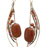 Bronze elongated semi circle earrings with goldstone gemstones and multi colored cubic zirconia
