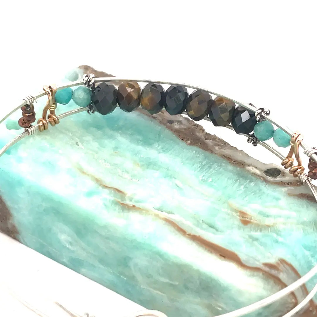 Skinny sterling silver hammered bracelet with faceted tiger's eye, amazonite, and pyrite gemstones, featuring darkened sterling silver twist and bronze hammered accents