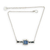 blue kyanite tile held between sterling silver fish tin shape necklace accented with aquamarine faceted gemstones