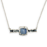 blue kyanite tile held between sterling silver fish tin shape necklace accented with aquamarine faceted gemstones