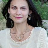 A pair of sterling silver and bronze hammered earrings with smooth prehnite coin and watermelon tourmaline gemstones, with built in earring hooks to wear like a post earring.