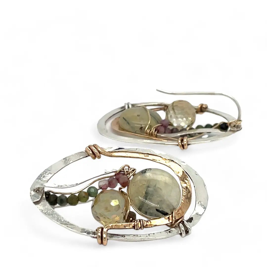 A pair of sterling silver and bronze hammered earrings with smooth prehnite coin and watermelon tourmaline gemstones, with built in earring hooks to wear like a post earring.