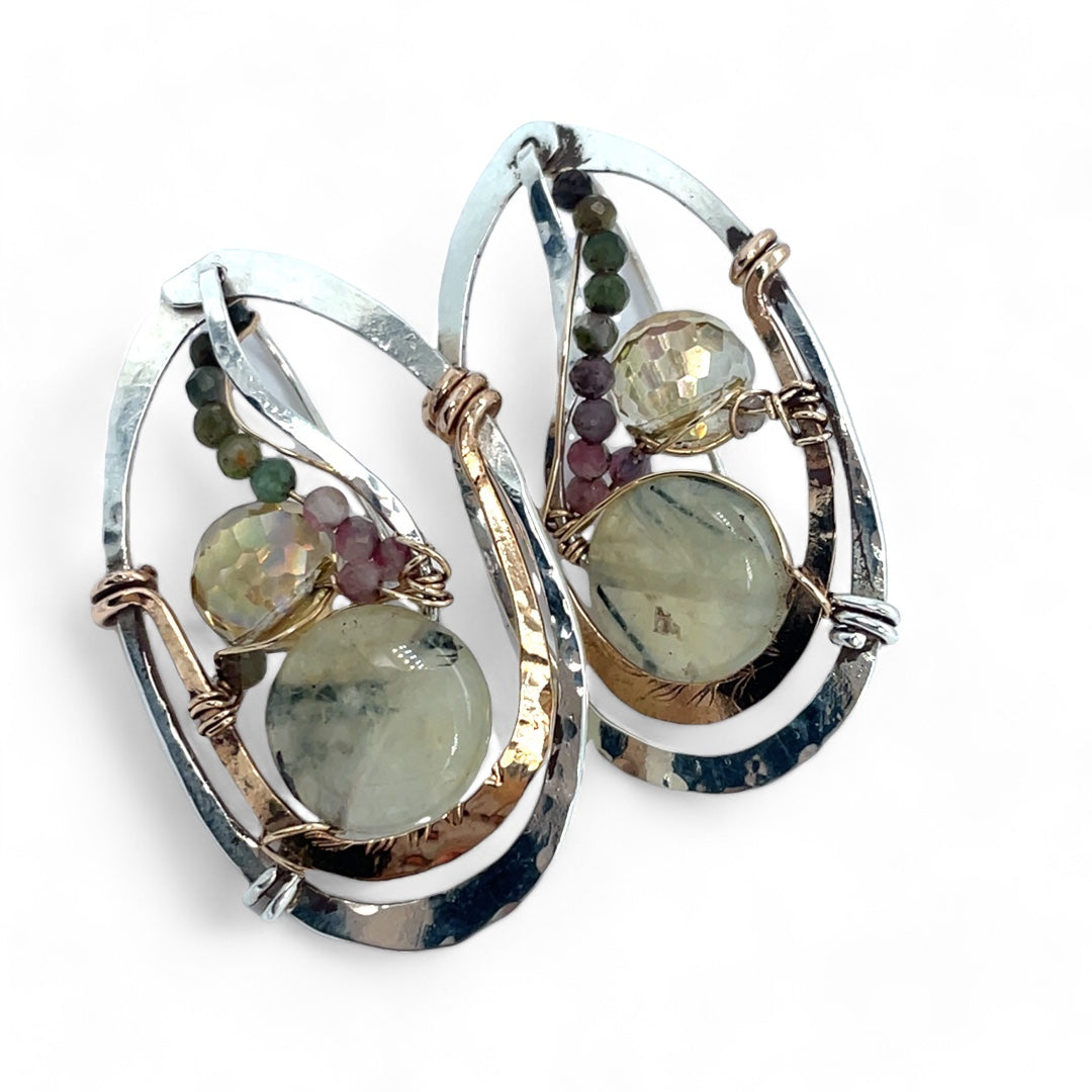 A pair of sterling silver and bronze hammered earrings with smooth prehnite coin and watermelon tourmaline gemstones, with built in earring hooks to wear like a post earring.