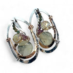 A pair of sterling silver and bronze hammered earrings with smooth prehnite coin and watermelon tourmaline gemstones, with built in earring hooks to wear like a post earring.