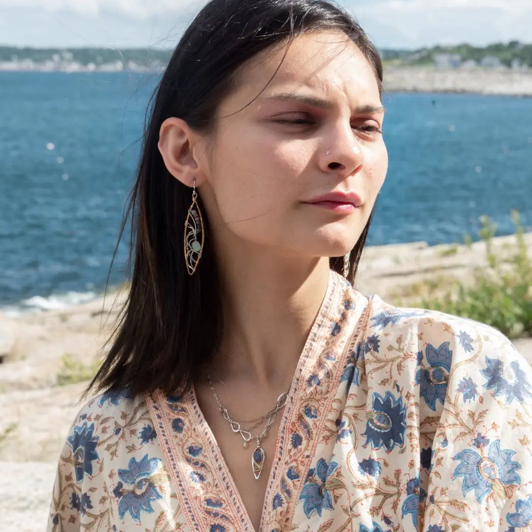 A pair of tourmaline and jade gemstone marquise bronze earrings with twisted sterling silver and crystal