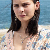 A pair of tourmaline and jade gemstone marquise bronze earrings with twisted sterling silver and crystal