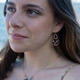 mauve moonstone and opal faceted gemstones held within a brass hammered ring hanging onto a sterling silver teardrop link mini earrings