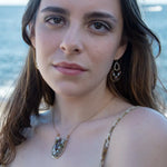 mauve moonstone and opal faceted gemstones held within a brass hammered ring hanging onto a sterling silver teardrop link mini earrings