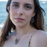 mauve moonstone and opal faceted gemstones held within a brass hammered ring hanging onto a sterling silver teardrop link mini earrings