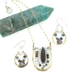 mauve moonstone and opal faceted gemstones held within a brass hammered ring hanging onto a sterling silver teardrop link mini earrings