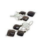 Smokey quartz tile and olive cat's eye gemstones hang from sterling silver triangle earrings filled with moonstone and fresh water pearl, featuring sterling silver earring hooks built in to wear like a post earring