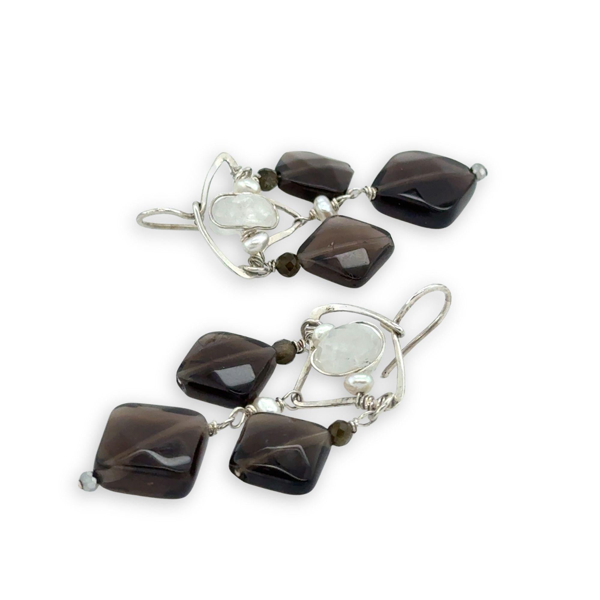 Smokey quartz tile and olive cat's eye gemstones hang from sterling silver triangle earrings filled with moonstone and fresh water pearl, featuring sterling silver earring hooks built in to wear like a post earring