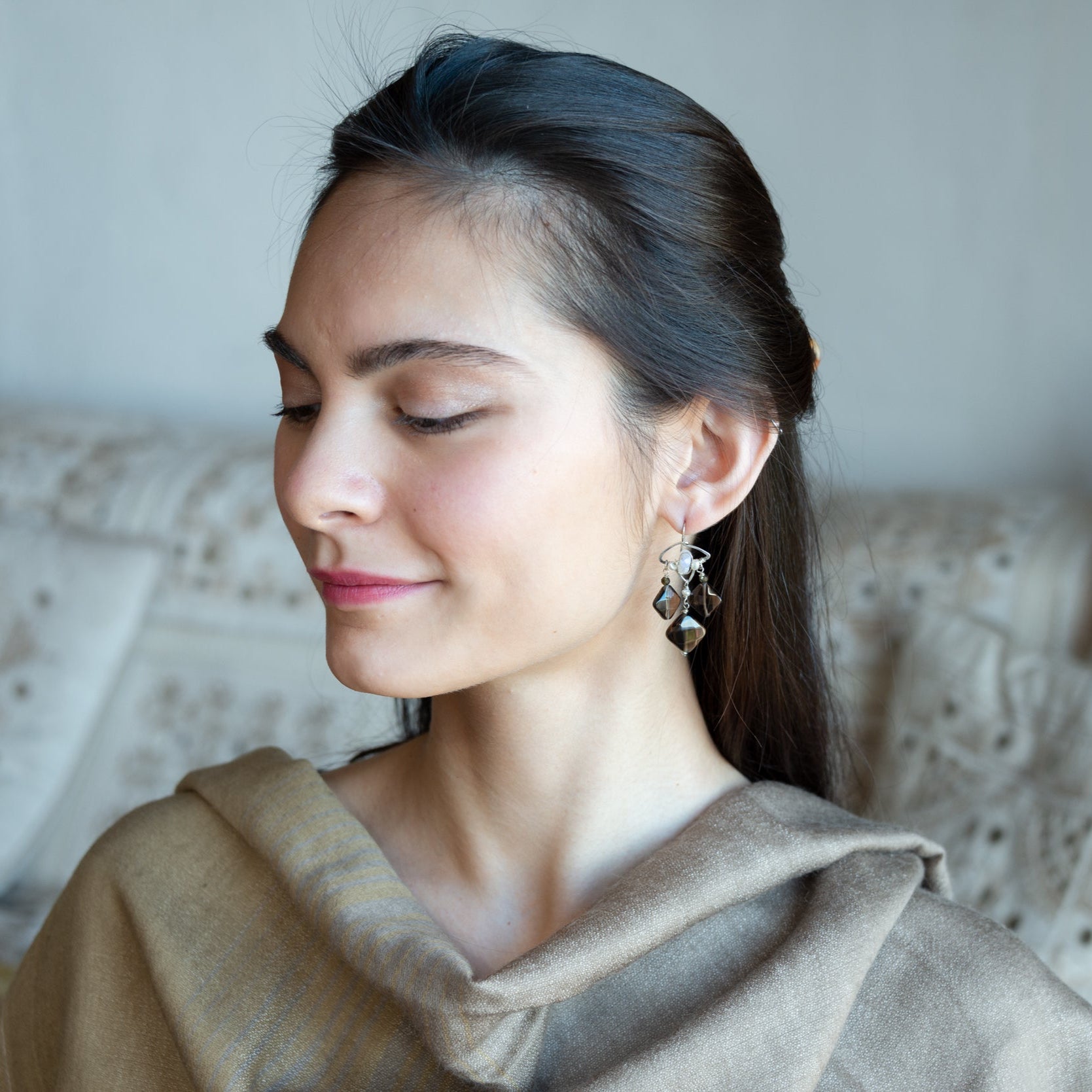 Smokey quartz tile and olive cat's eye gemstones hang from sterling silver triangle earrings filled with moonstone and fresh water pearl, featuring sterling silver earring hooks built in to wear like a post earring