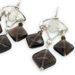 Smokey quartz tile and olive cat's eye gemstones hang from sterling silver triangle earrings filled with moonstone and fresh water pearl, featuring sterling silver earring hooks built in to wear like a post earring