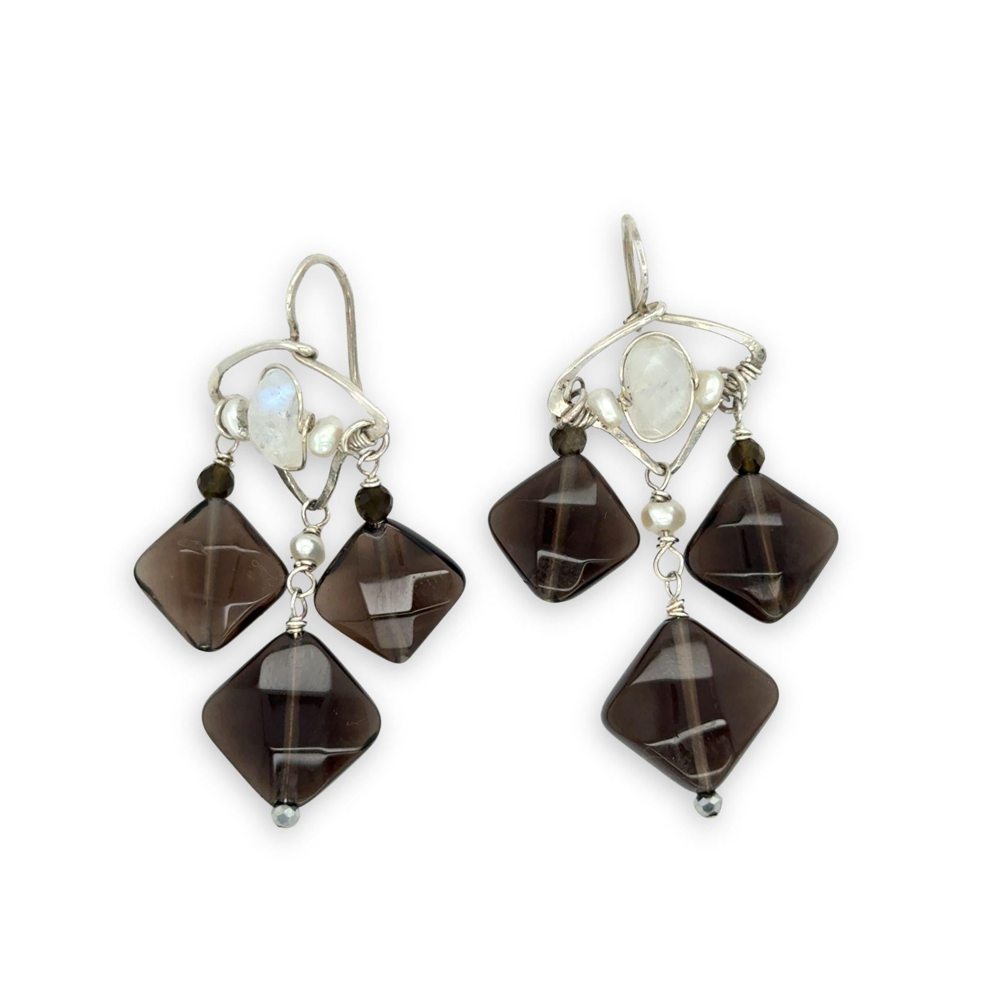 Smokey quartz tile and olive cat's eye gemstones hang from sterling silver triangle earrings filled with moonstone and fresh water pearl, featuring sterling silver earring hooks built in to wear like a post earring