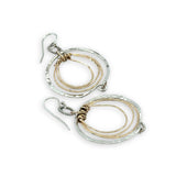 Pair of handmade hammered sterling silver and bronze layered mini hoops on a braided sterling link