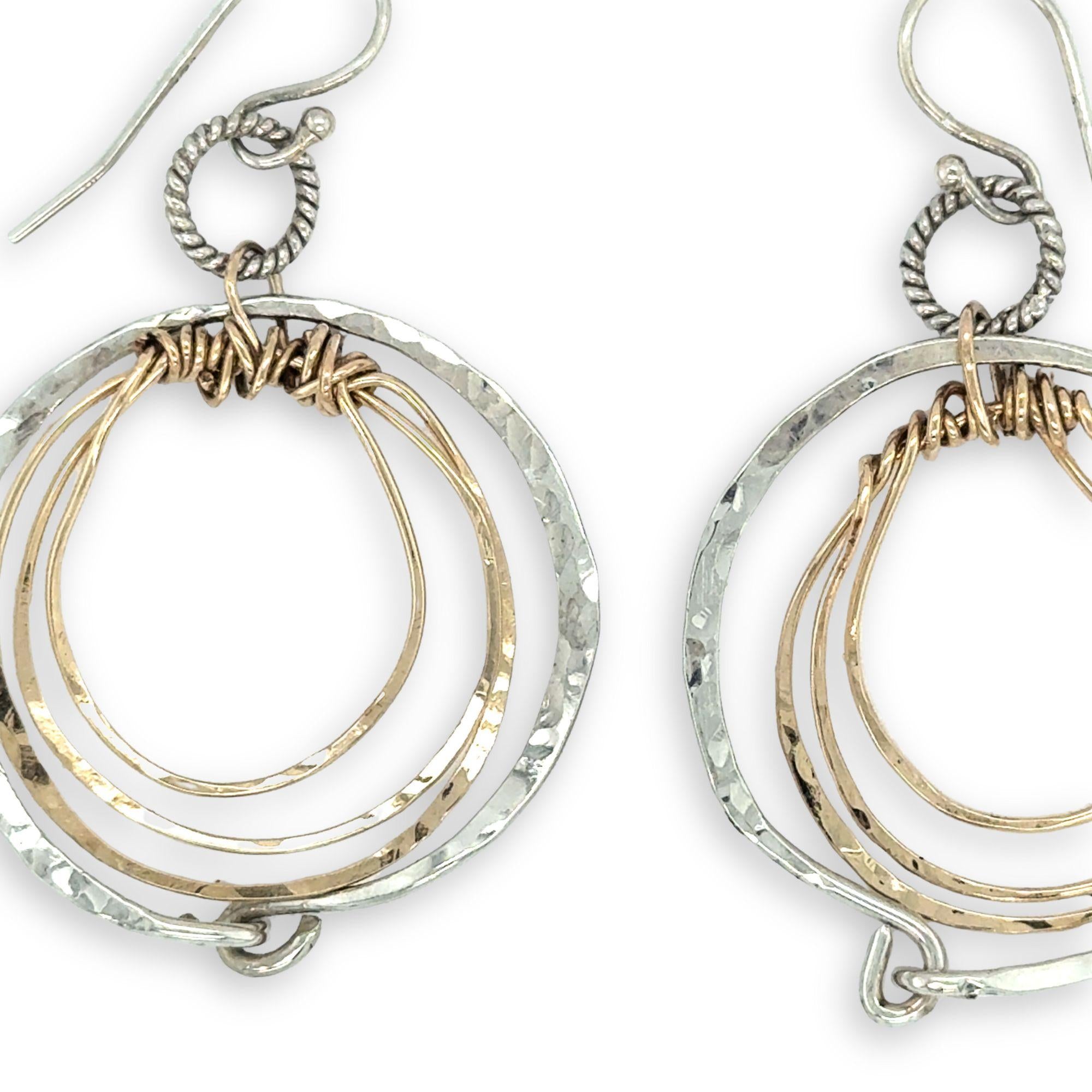 Pair of handmade hammered sterling silver and bronze layered mini hoops on a braided sterling link