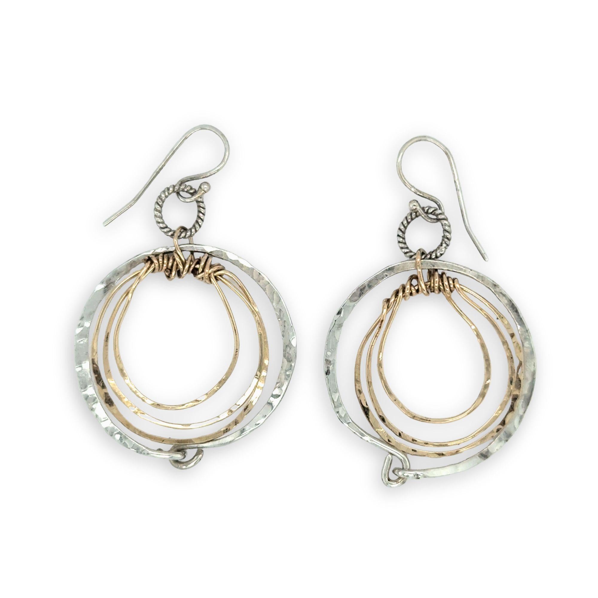 Pair of handmade hammered sterling silver and bronze layered mini hoops on a braided sterling link