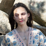 Triple handmade hammered sterling silver teardrops interlocked within each other to make a long earring