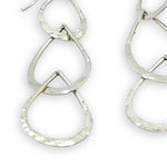 Triple handmade hammered sterling silver teardrops interlocked within each other to make a long earring