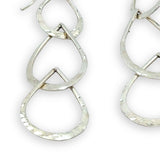 Triple handmade hammered sterling silver teardrops interlocked within each other to make a long earring