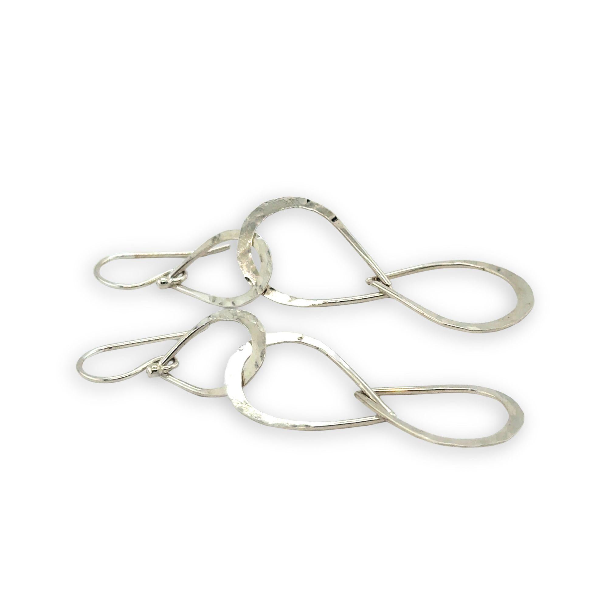 Triple handmade hammered sterling silver teardrops interlocked within each other to make a long earring