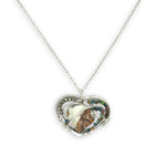 Necklace with a heart-shaped sterling silver hammered pendant featuring a gaspeite, turquoise, and pyrite gemstones