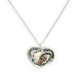 Necklace with a heart-shaped sterling silver hammered pendant featuring a gaspeite, turquoise, and pyrite gemstones