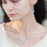 Double teardrop earrings with faceted blue quartz and turquoise gemstones wrapped in gold filled wire