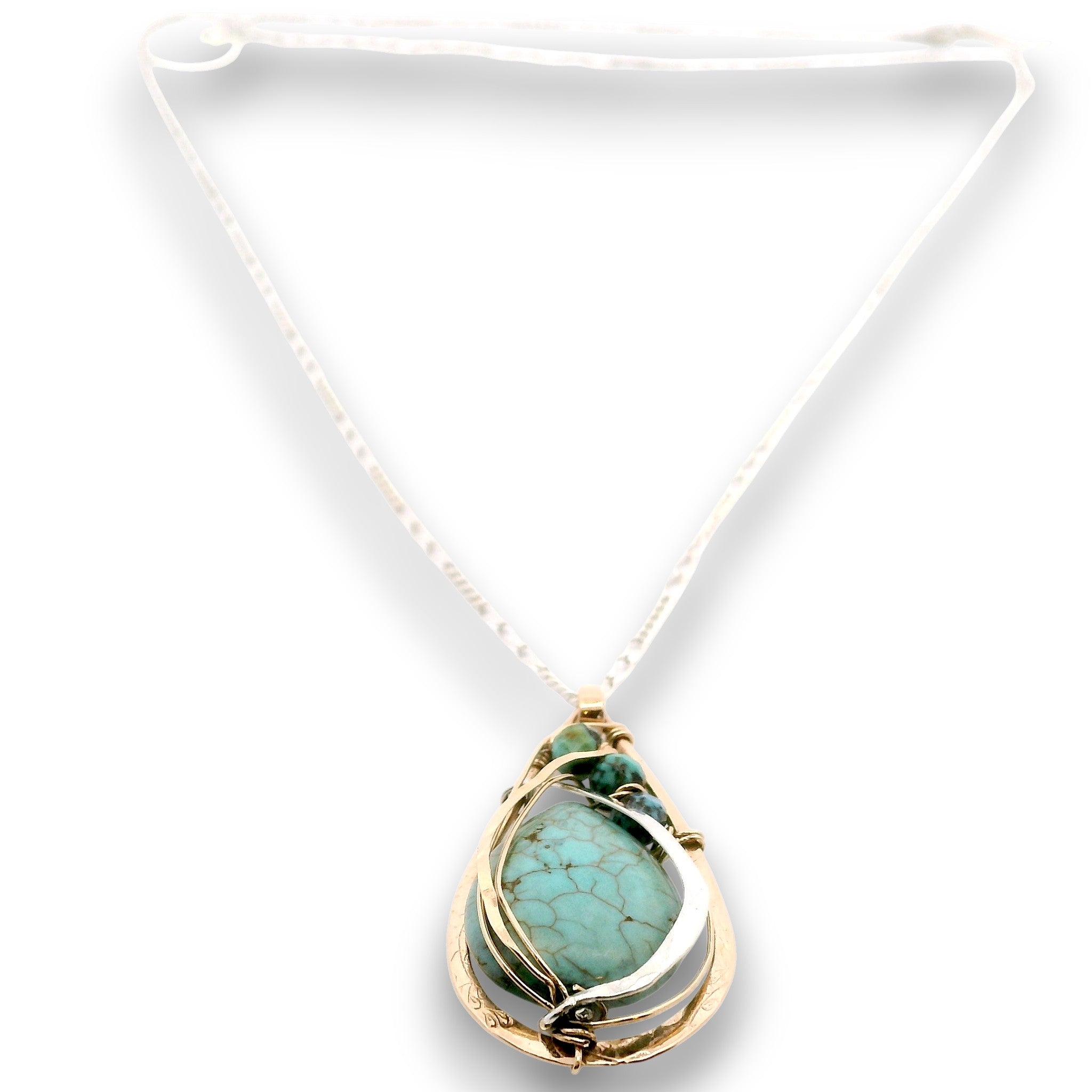 Floral stamped bronze drop pendant filled with turquoise gemstones, hammered sterling silver, and 14k gold filled wire on a sterling silver chain necklace
