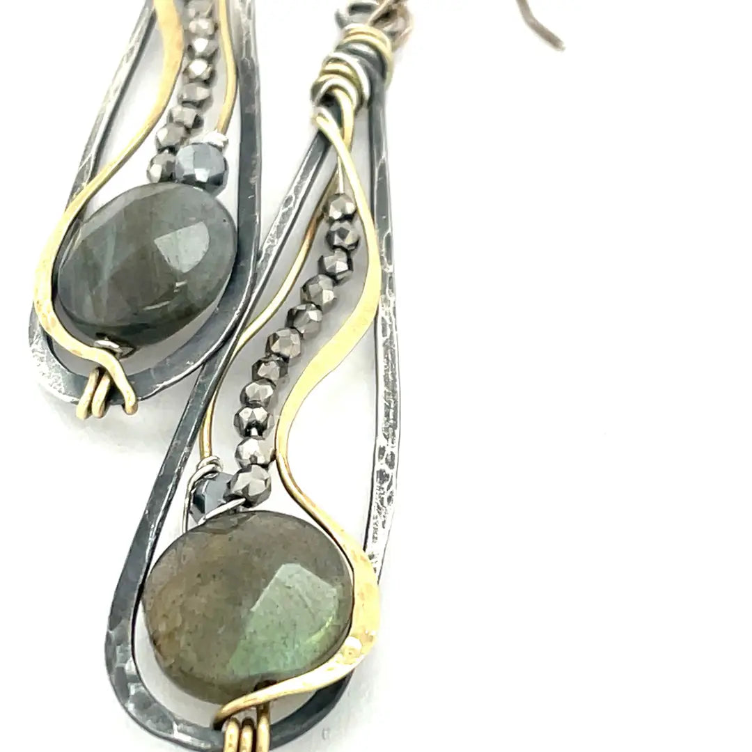 Oxidized sterling silver long drop earrings with labradorite and pyrite gemstones held within brass and sterling silver wire